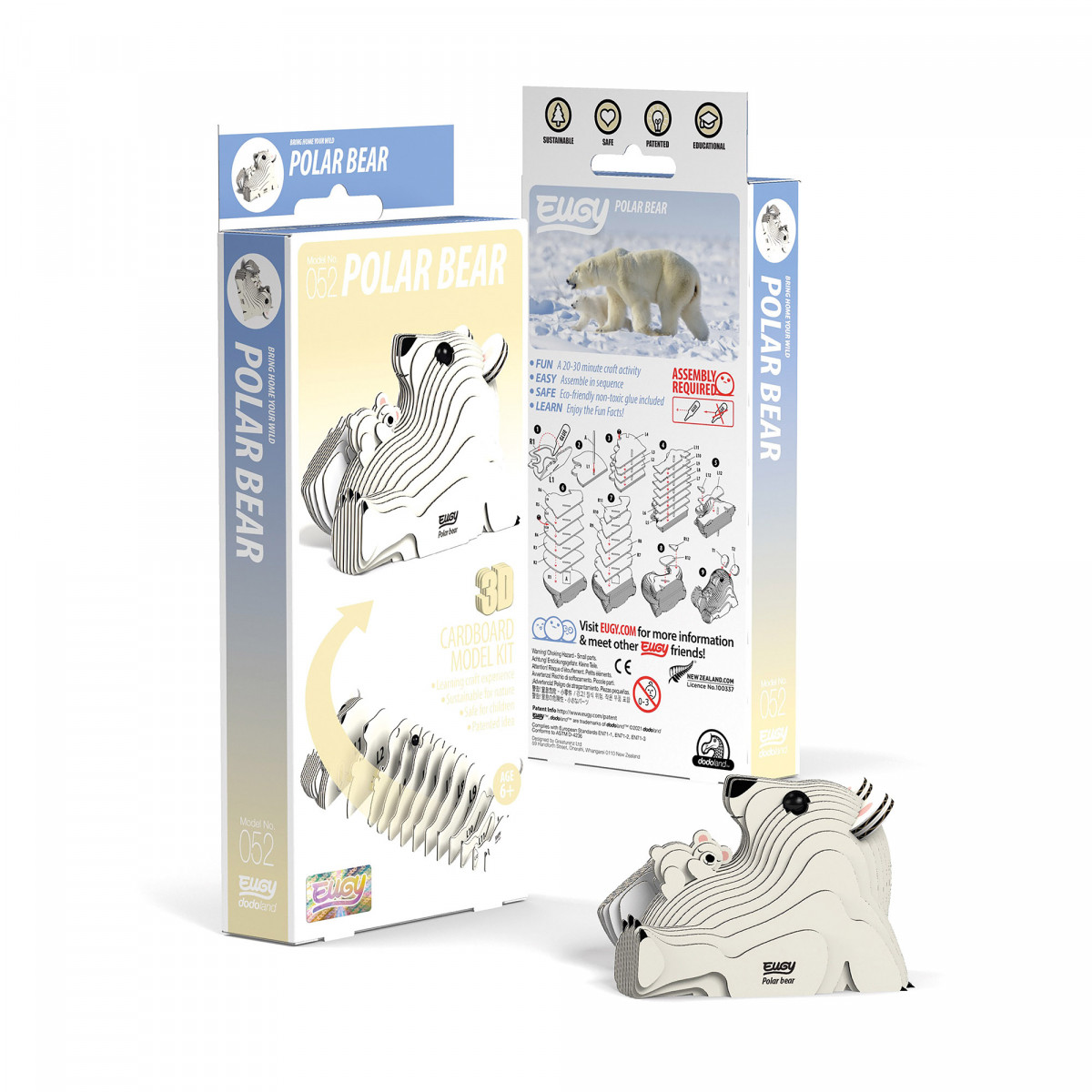 3D-Papp-Polarbär-Bausatz: Verpackung und zusammengebautes Modell vor den Kartons.