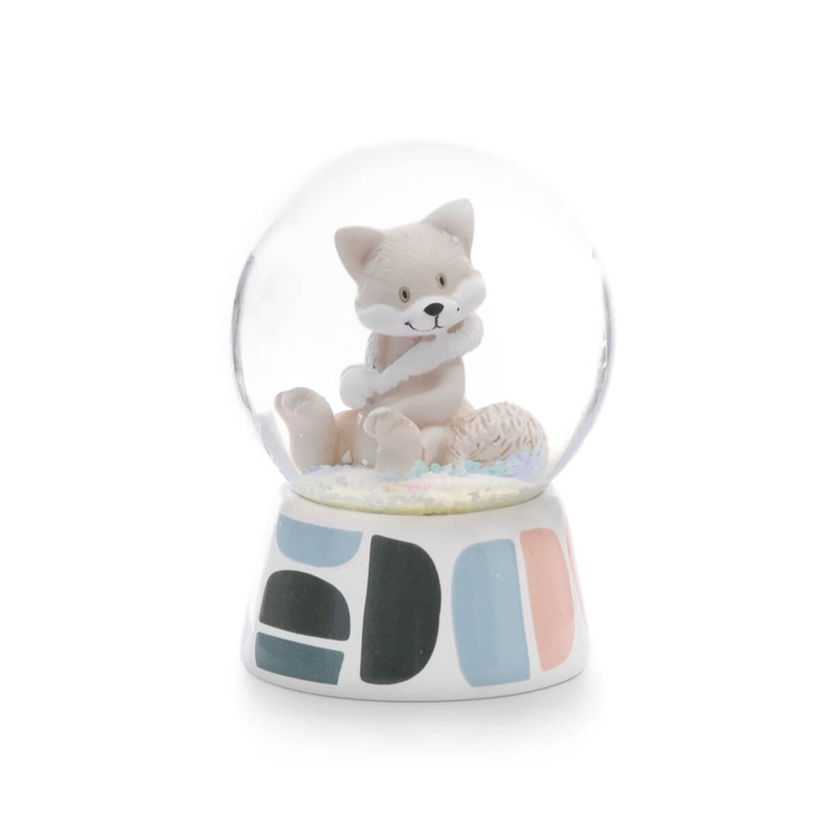 Schneekugel mit niedlicher, beigefarbener Fuchsfigur und Sockel mit bunten geometrischen Mustern.