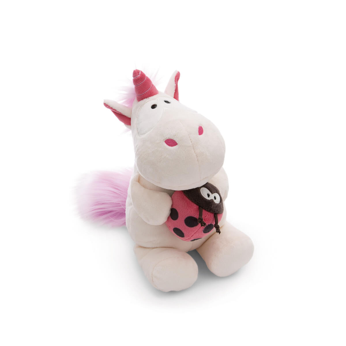 Plüsch-Einhorn mit pinker Mähne und Schwanz hält ein kleines Marienkäfer-Plüschtier und sitzt aufrecht.