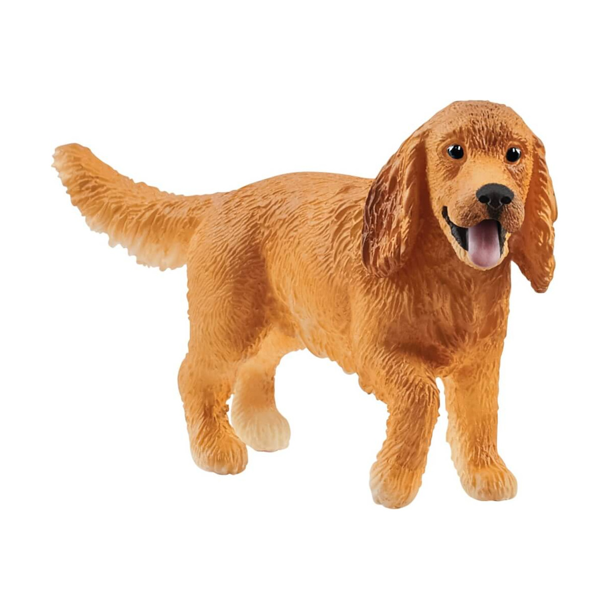 Kleiner, brauner Stoffhund mit Schlappohren und heraushängender Zunge steht auf allen vieren.