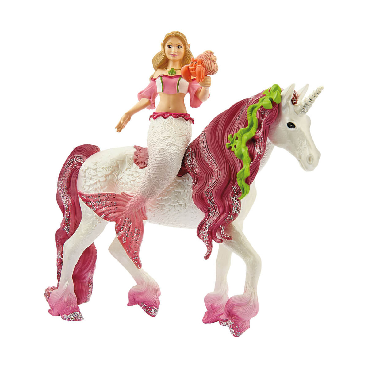Eine Meerjungfrauenpuppe mit Muschel reitet auf einem weißen Einhorn mit rosa Mähnen und grünen Bändern.