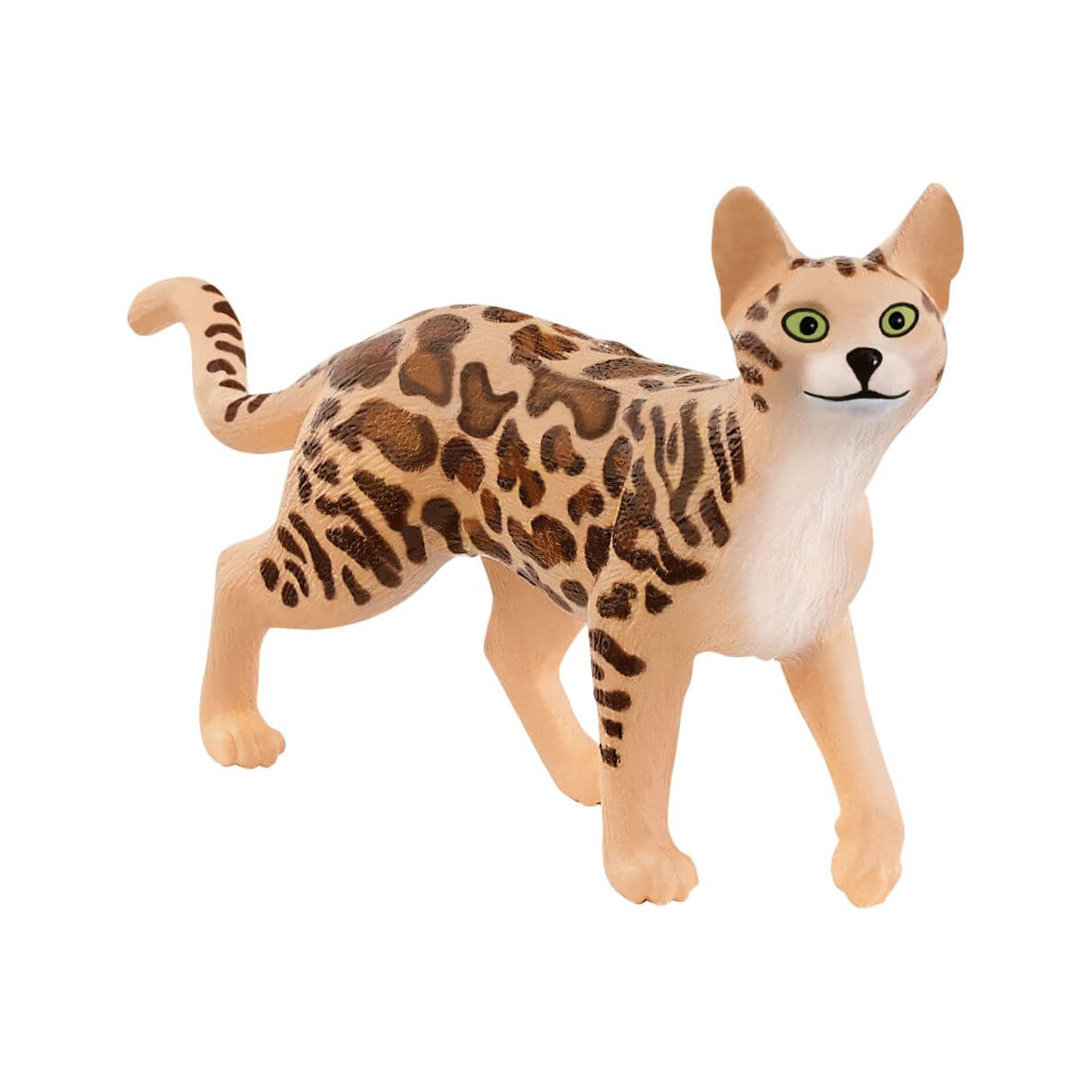 Spielfigur einer getupften Katze mit grünen Augen und aufrechten Ohren, die auf allen vier Beinen steht.