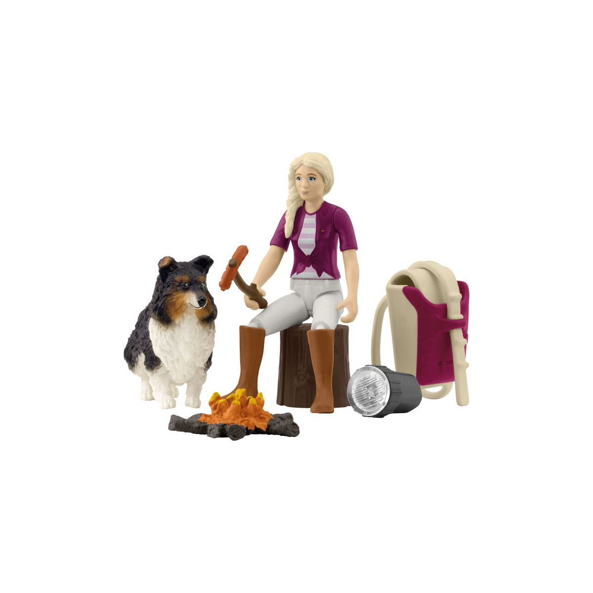 Spielfigur eines Mädchens mit Hund, Lagerfeuer, Rucksack, Taschenlampe und Stock am Feuer.
