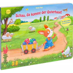 Kinderbuch: Ein Cartoon-Hase zieht einen Ostereierwagen über einen Weg, Schafe und Feld im Hintergrund.