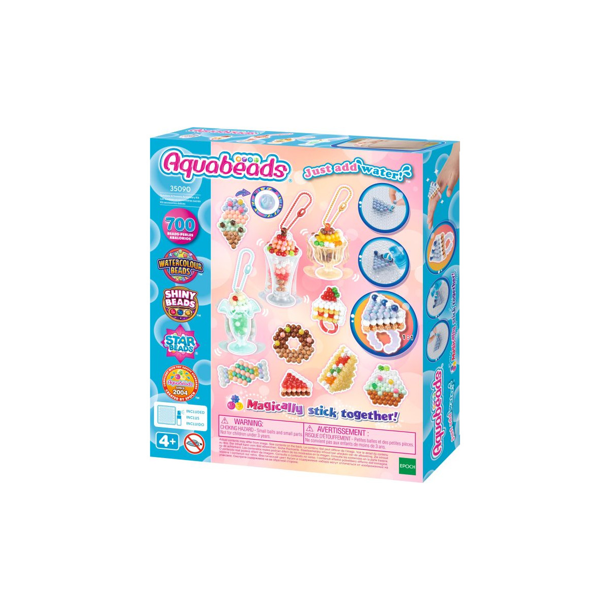 Aquabeads Bastelset mit bunten Perlenkreationen und Anleitung auf rosa-blauem Hintergrund.
