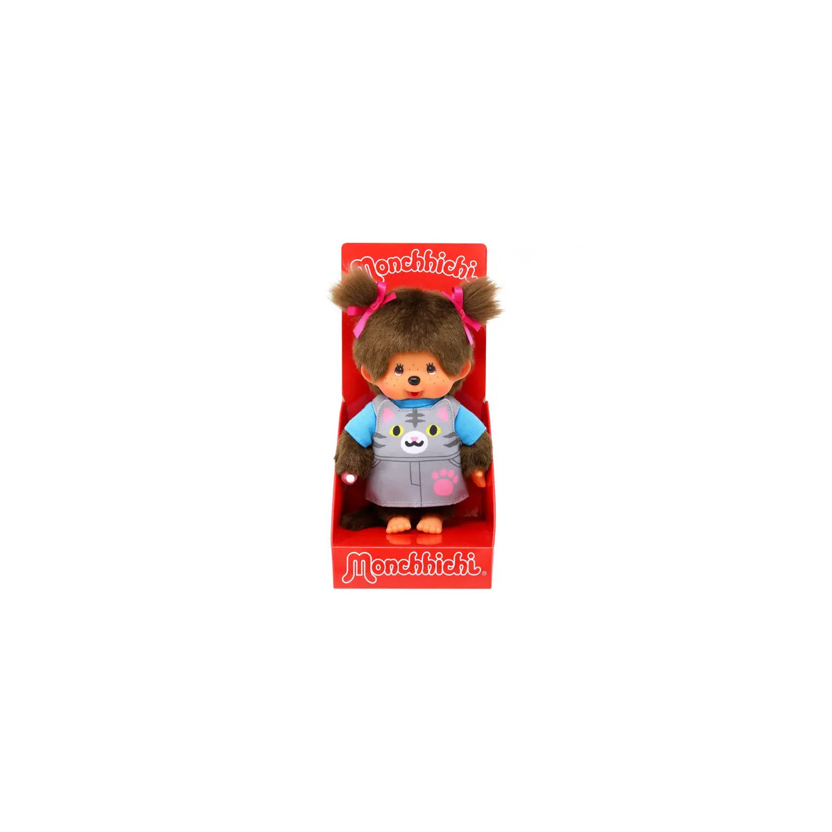 Monchhichi-Puppe mit braunem Fell, rosa Schleifen und grauem Outfit in roter Monchhichi-Verpackung.