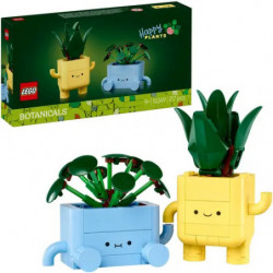 img_0:Zwei LEGO-Pflanztöpfe in Blau und Gelb mit Gesichtern stehen neben ihrer LEGO-Botanicals-Verpackung.