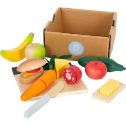 img_0:Spielset mit Obst, Gemüse, Messer, Schneidebrett und Butter aus Holz sowie Kartonbox.