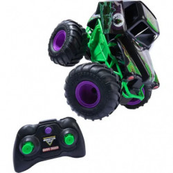 img_0:Ferngesteuertes schwarzes und grünes Monstertruck-Spielzeug mit großen Rädern und passender Fernbedienung.