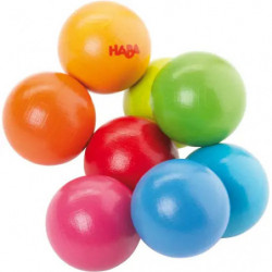 img_0:Sieben bunte Holzkugeln liegen gruppiert auf weißem Hintergrund.