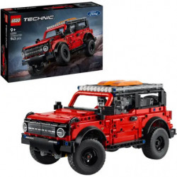 img_0:LEGO Technic rotes Ford Bronco Modell vor der Verpackung auf weißer Fläche.