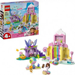 img_0:LEGO-Set mit Schachtel, Figuren und pastellfarbenem Schloss vor weißem Hintergrund.